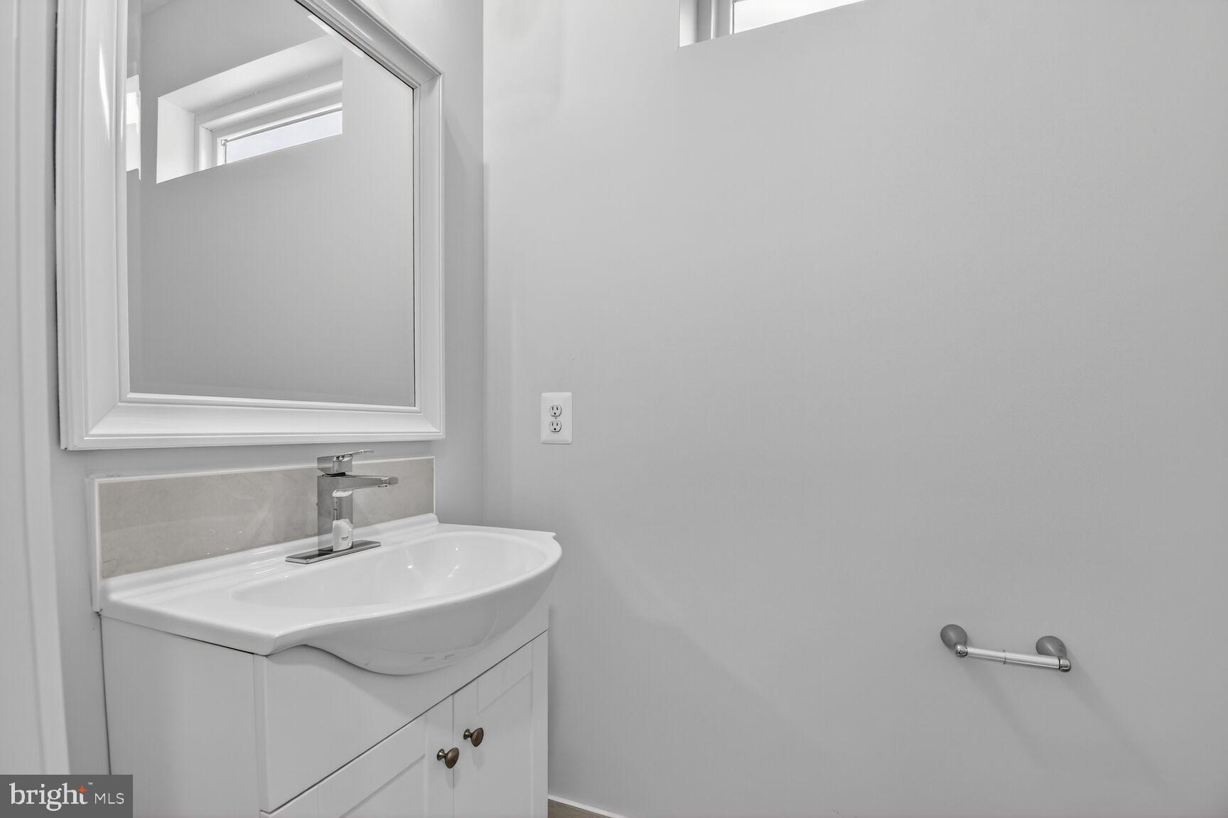 13102 Ideal Drive Silver Spring, MD 20906 - Photo 27 of 48 a bathroom with a sink and a mirror