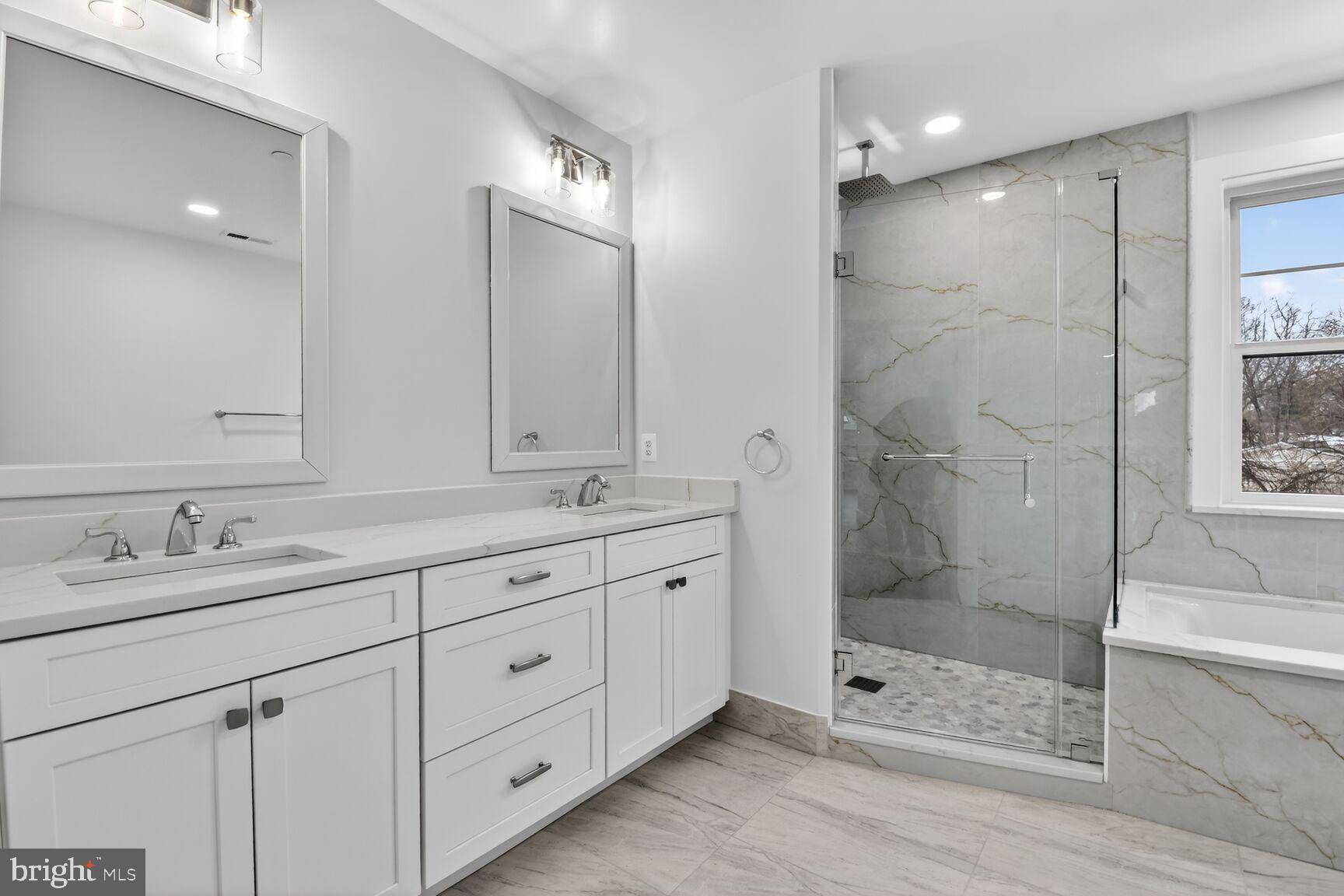 13102 Ideal Drive Silver Spring, MD 20906 - Photo 28 of 48 a bathroom with double sink and a shower