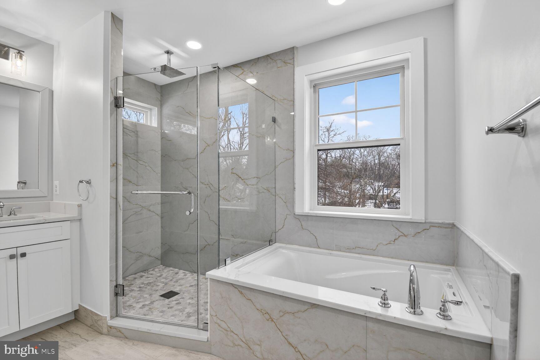 13102 Ideal Drive Silver Spring, MD 20906 - Photo 29 of 48 a bathroom with a bathtub a shower a sink and toilet