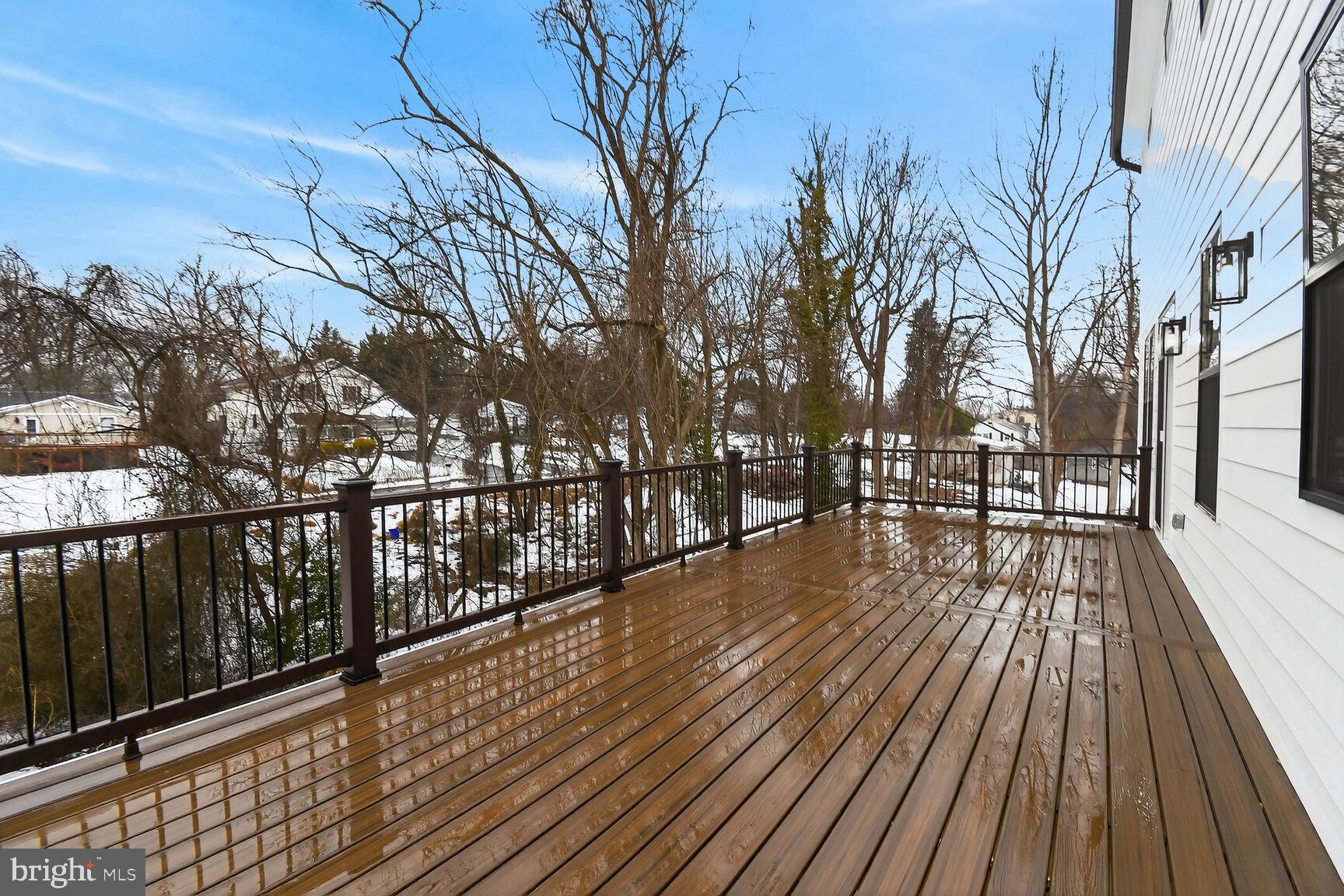 13102 Ideal Drive Silver Spring, MD 20906 - Photo 9 of 48 a view of wooden balcony with a couple of water