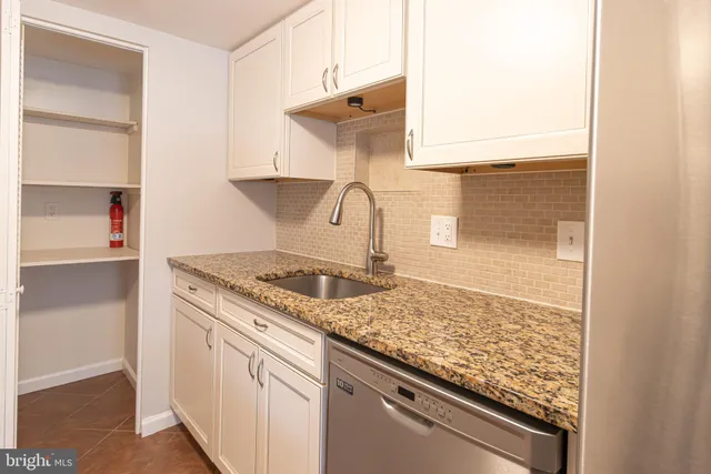 a kitchen with a stove and a cabinet