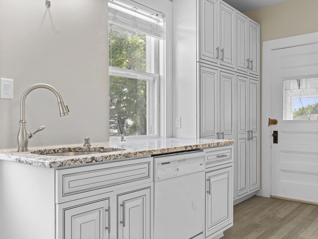 47 Alleyne Street Boston, MA 02132 - Photo 11 of 30 a view of cabinets with wooden floor