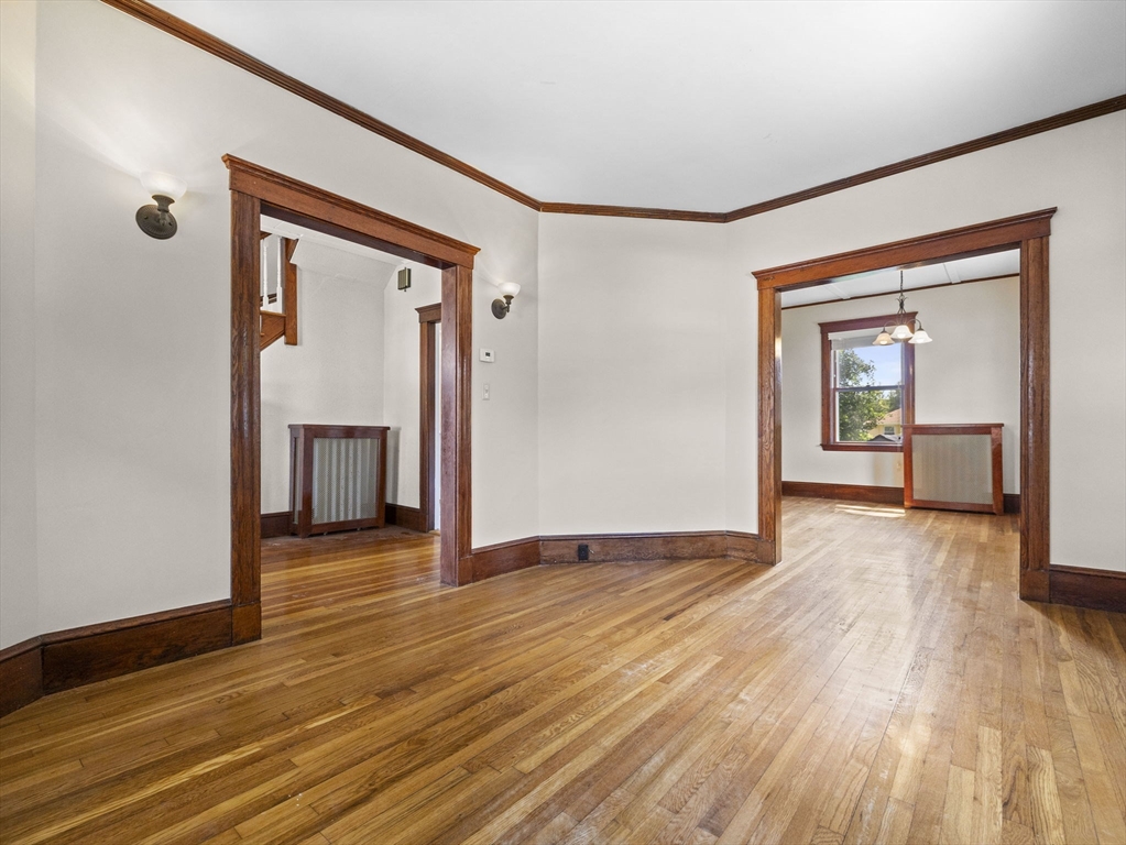 47 Alleyne Street Boston, MA 02132 - Photo 17 of 30 a view of an empty room with wooden floor and a window