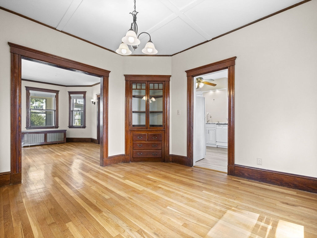 47 Alleyne Street Boston, MA 02132 - Photo 18 of 30 a view of an empty room with window and wooden floor