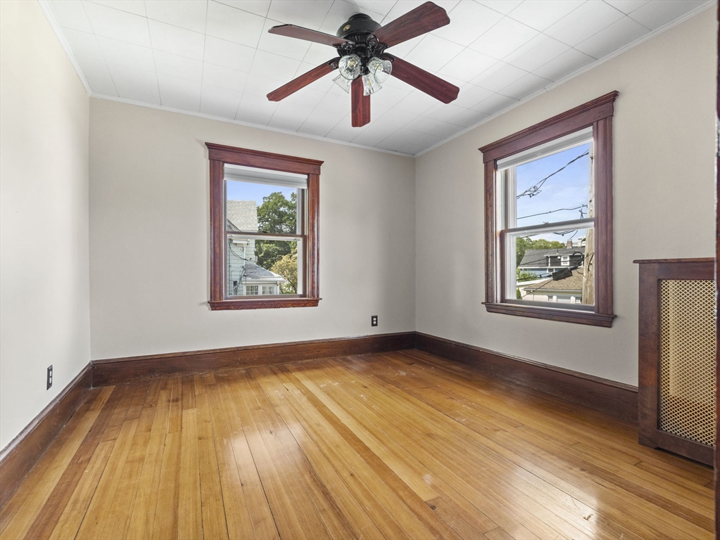47 Alleyne Street Boston, MA 02132 - Photo 24 of 30 a view of an empty room with window and wooden floor