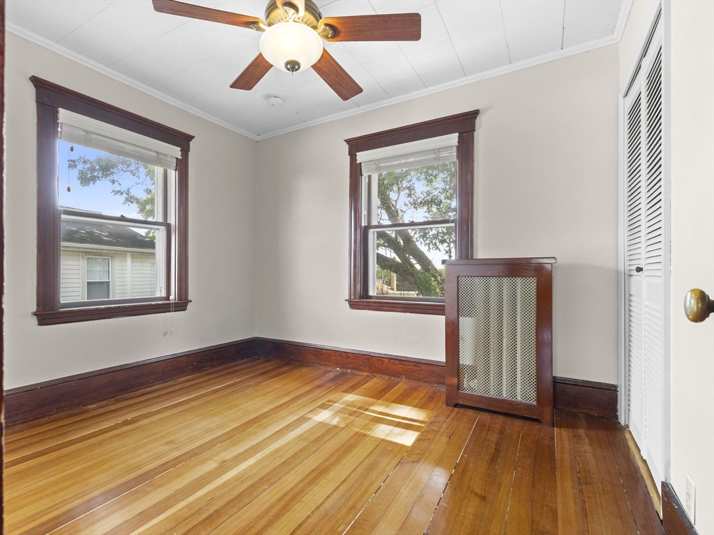 47 Alleyne Street Boston, MA 02132 - Photo 25 of 30 a view of empty room with wooden floor and fan