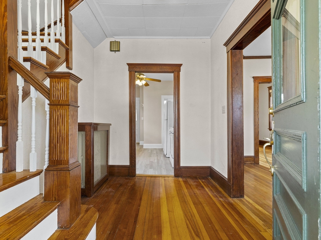 47 Alleyne Street Boston, MA 02132 - Photo 8 of 30 a view of a hallway with wooden floor and staircase