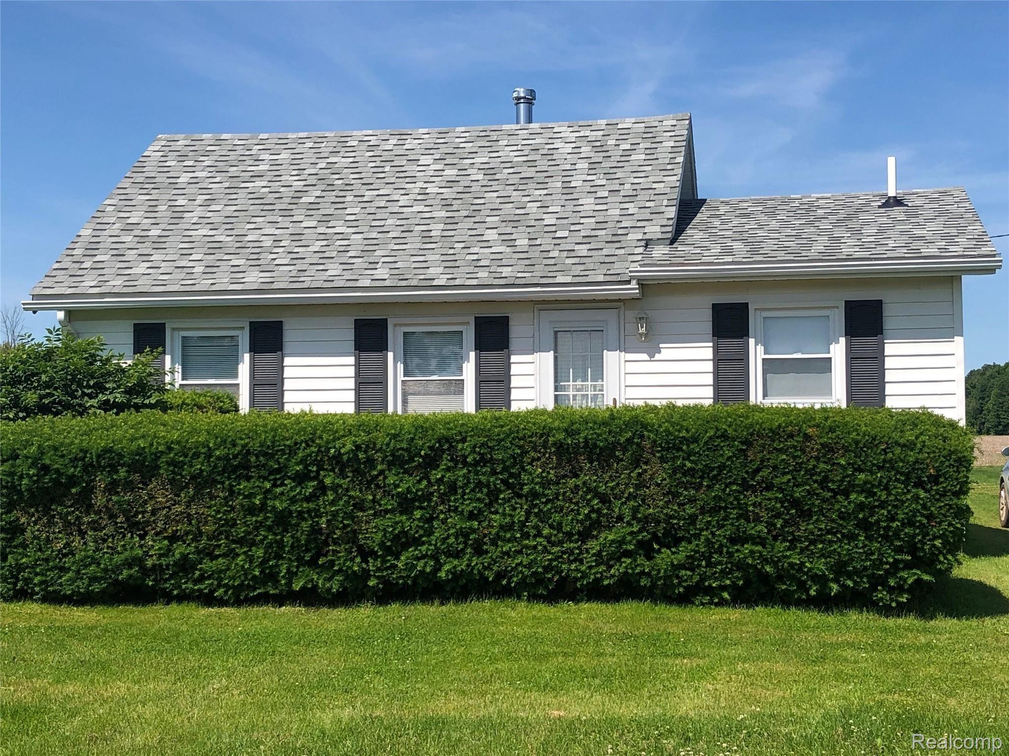 3663 Kilgore Road Avoca, MI 48006 - Photo 2 of 57 Deck is surrounded by shrubs for privacy