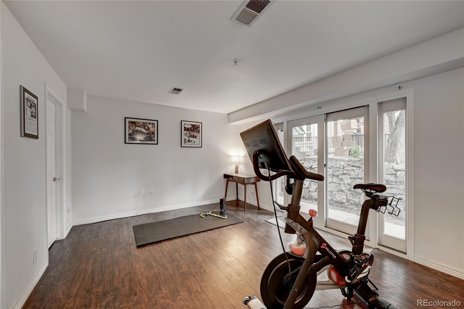 45 Jackson Street, Unit D Denver, CO 80206 - Photo 18 of 26 a view of a room with gym equipment