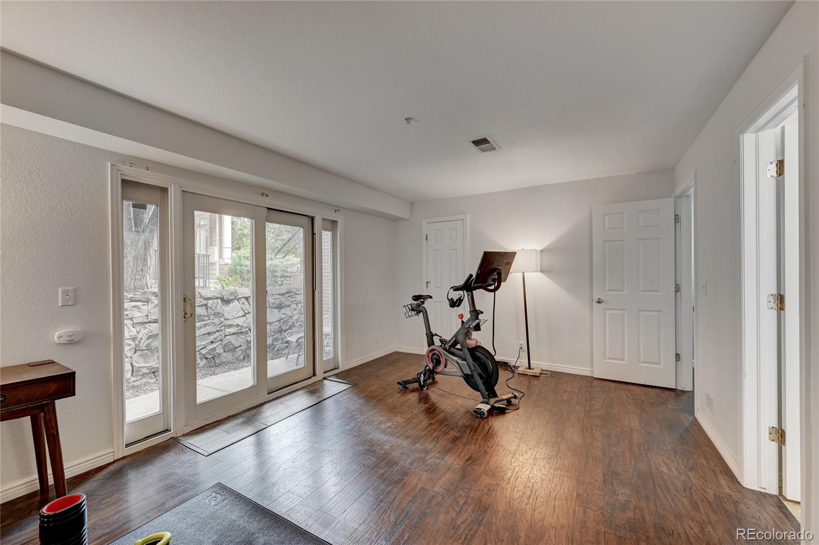 45 Jackson Street, Unit D Denver, CO 80206 - Photo 19 of 26 a view of a room with gym equipment