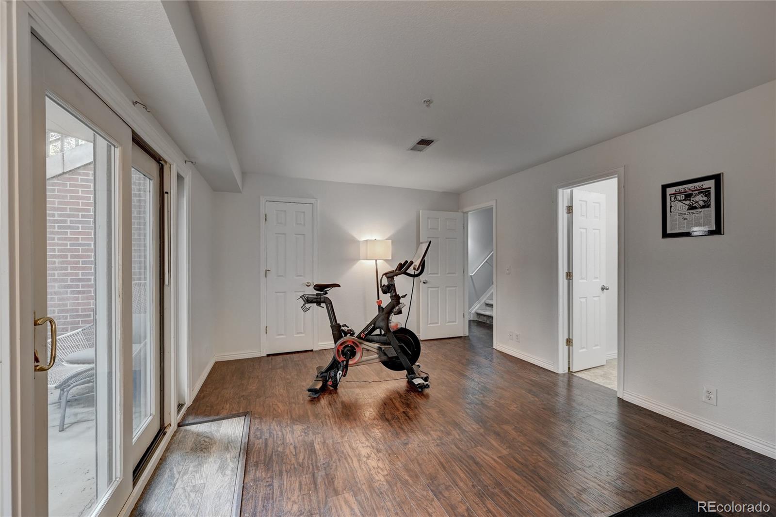 45 Jackson Street, Unit D Denver, CO 80206 - Photo 20 of 26 a view of a room with wooden floor and windows
