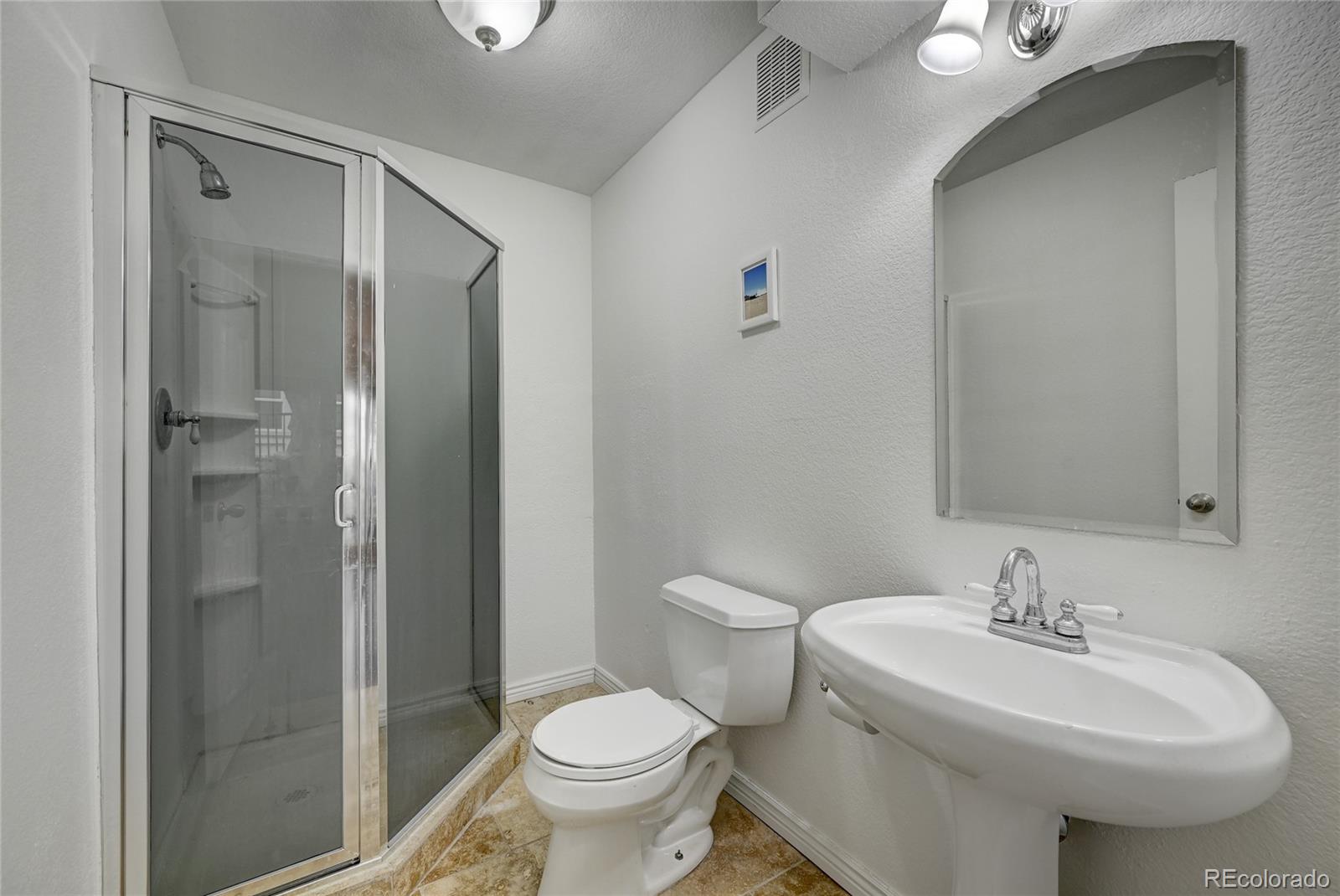 45 Jackson Street, Unit D Denver, CO 80206 - Photo 21 of 26 a bathroom with a sink toilet and shower