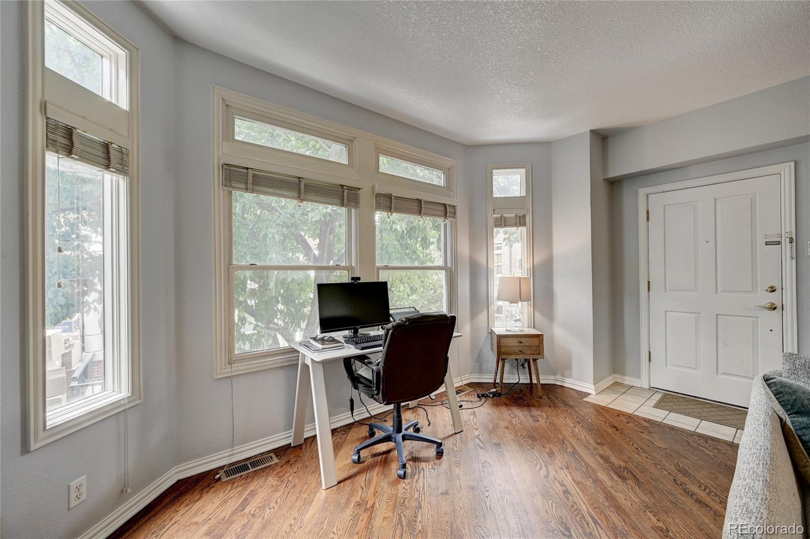 45 Jackson Street, Unit D Denver, CO 80206 - Photo 7 of 26 a view of a workspace with furniture and a window