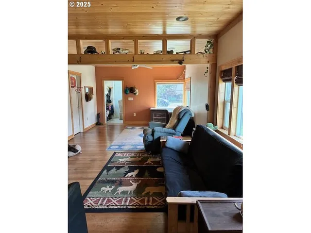 a hallway with table and couch