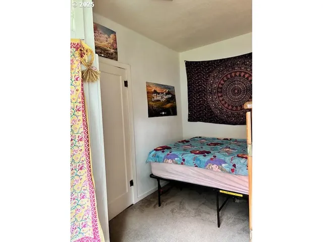 a bed room with a bed and a walk in closet