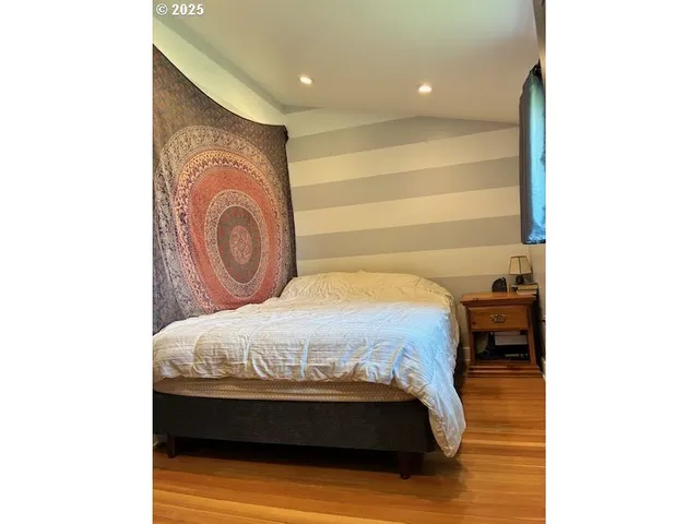 a view of living room with furniture and large window