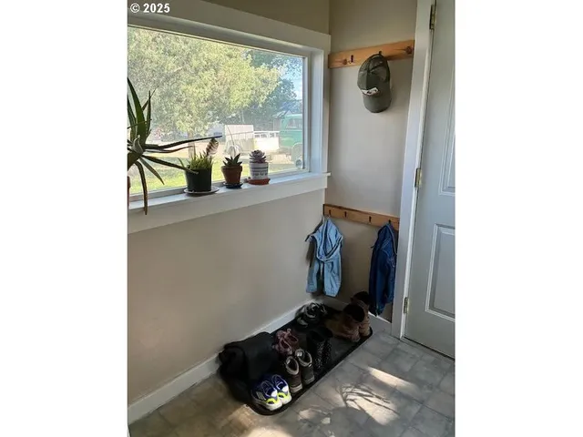 a view of a storage and utility room with a sink