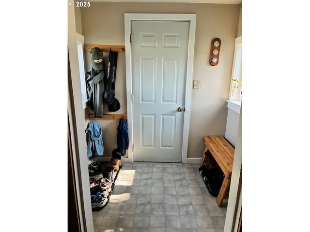 a view of a livingroom with furniture and a window