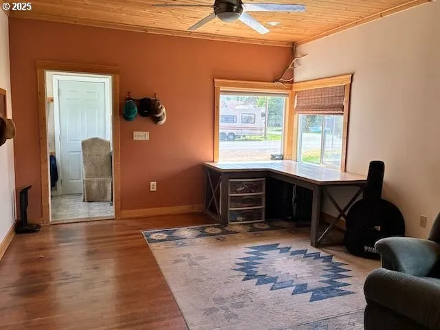 a living room with furniture rug and wooden floor