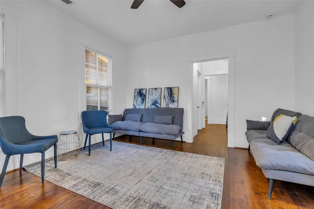 a living room with furniture or couch and a wooden floor