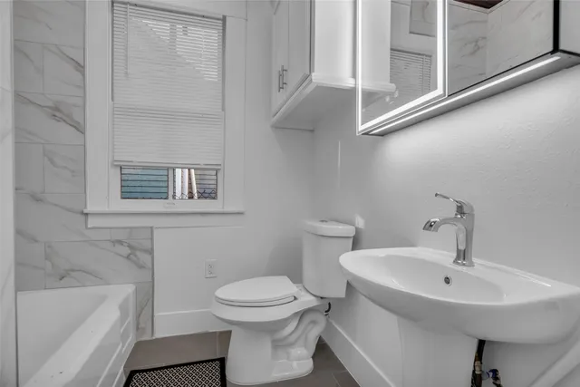 a bathroom with a sink and a bathtub