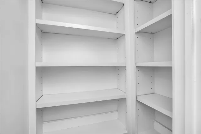 a view of an empty walk in closet