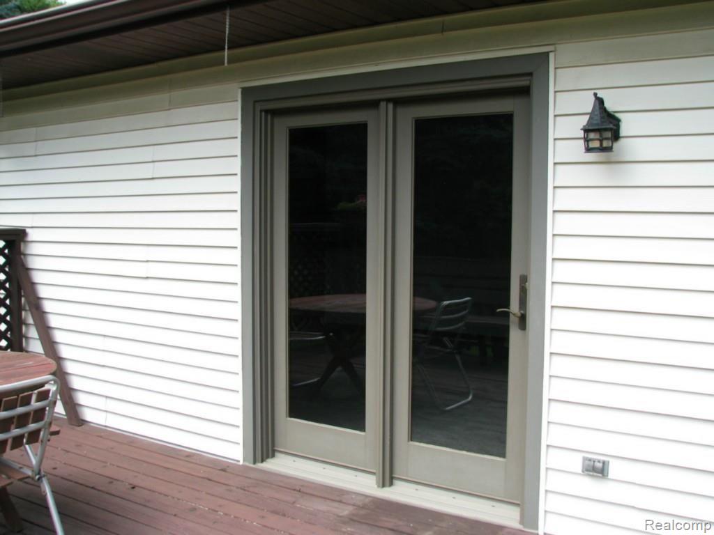9334 Hilton Road Brighton, MI 48114 - Photo 7 of 34 Close view deck to family room through Pella French door
