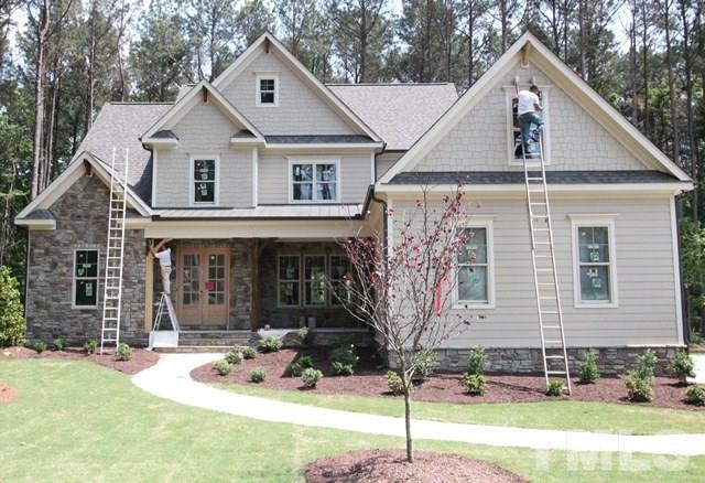 13804 Durant Road Raleigh, NC 27614 - Photo 1 of 25 a front view of a house with garden