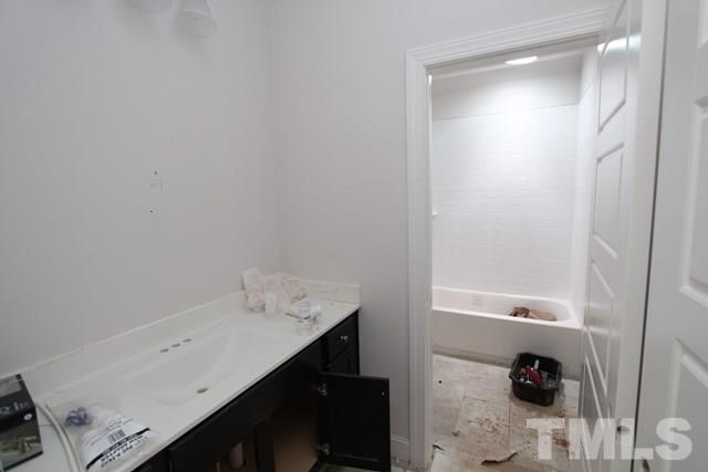 13804 Durant Road Raleigh, NC 27614 - Photo 19 of 25 a bathroom with a sink and a mirror