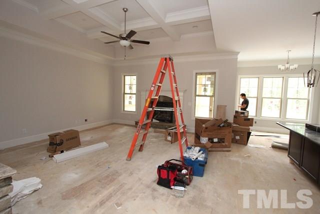 13804 Durant Road Raleigh, NC 27614 - Photo 3 of 25 a room with gym equipment and a window
