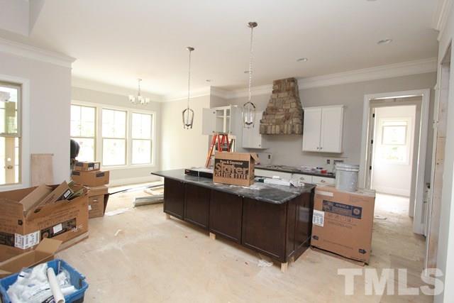 13804 Durant Road Raleigh, NC 27614 - Photo 6 of 25 a living room with stainless steel appliances kitchen island granite countertop furniture and a large window