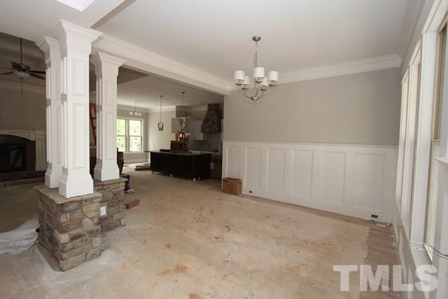 13804 Durant Road Raleigh, NC 27614 - Photo 8 of 25 a view of a livingroom with furniture cabinet and front door