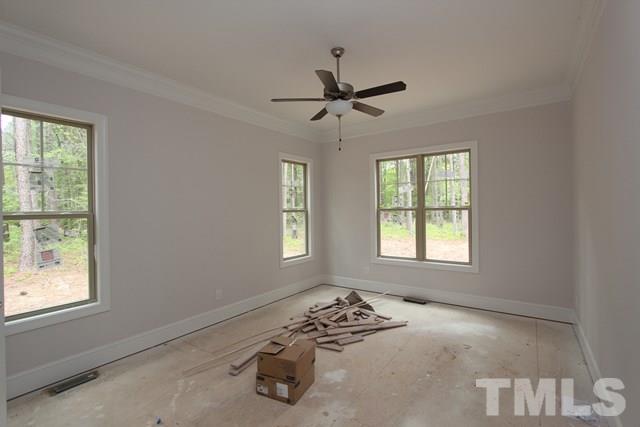 13804 Durant Road Raleigh, NC 27614 - Photo 10 of 25 a bedroom with a bed and a window