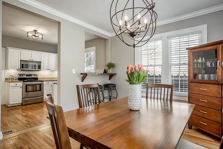 237 Cherokee Road Nashville, TN 37205 - Photo 11 of 30 a view of a dining room and livingroom with furniture wooden floor a chandelier