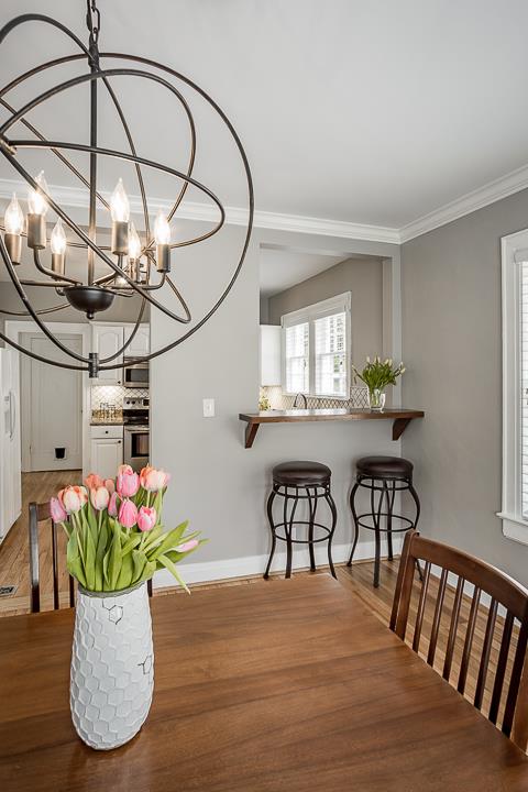 237 Cherokee Road Nashville, TN 37205 - Photo 12 of 30 a view of a dining room with furniture and a potted plant