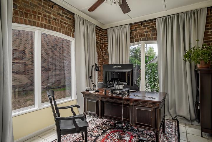 237 Cherokee Road Nashville, TN 37205 - Photo 14 of 30 a living room with furniture a flat screen tv and a large window