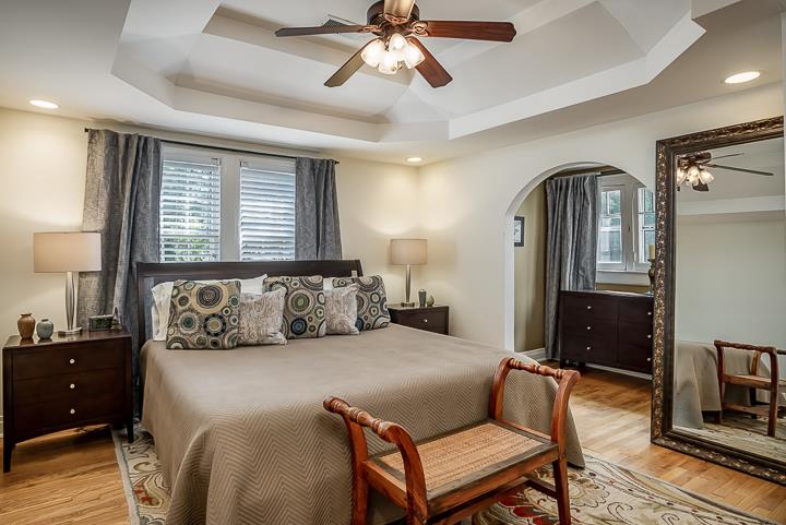 237 Cherokee Road Nashville, TN 37205 - Photo 17 of 30 a bedroom with a bed dresser and a window