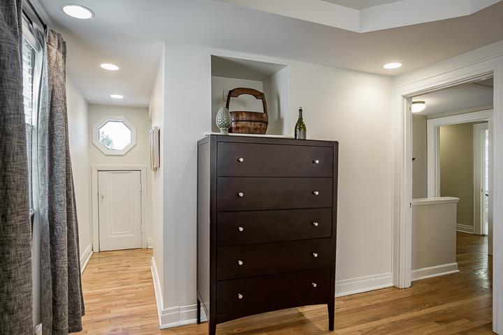 237 Cherokee Road Nashville, TN 37205 - Photo 19 of 30 a view of a sink and mirror with wooden floor