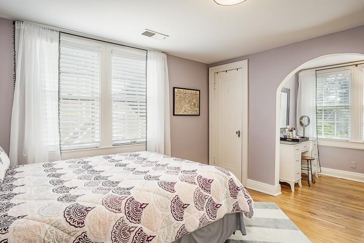 237 Cherokee Road Nashville, TN 37205 - Photo 22 of 30 a bedroom with a bed and wooden floor