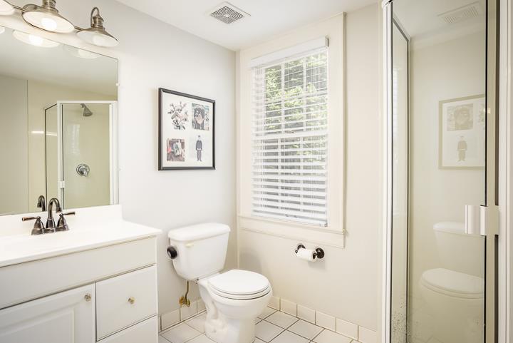 237 Cherokee Road Nashville, TN 37205 - Photo 24 of 30 a bathroom with a sink a toilet a shower and a mirror