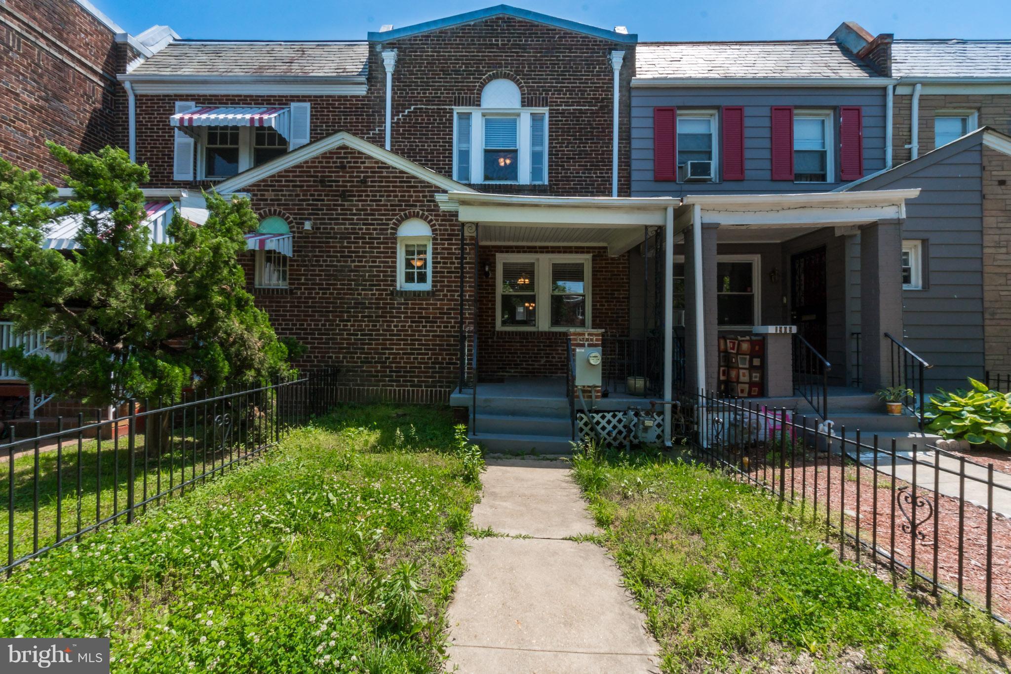 1911 D Street Northeast Washington, DC 20002 - Photo 2 of 25 a front view of a house with a yard
