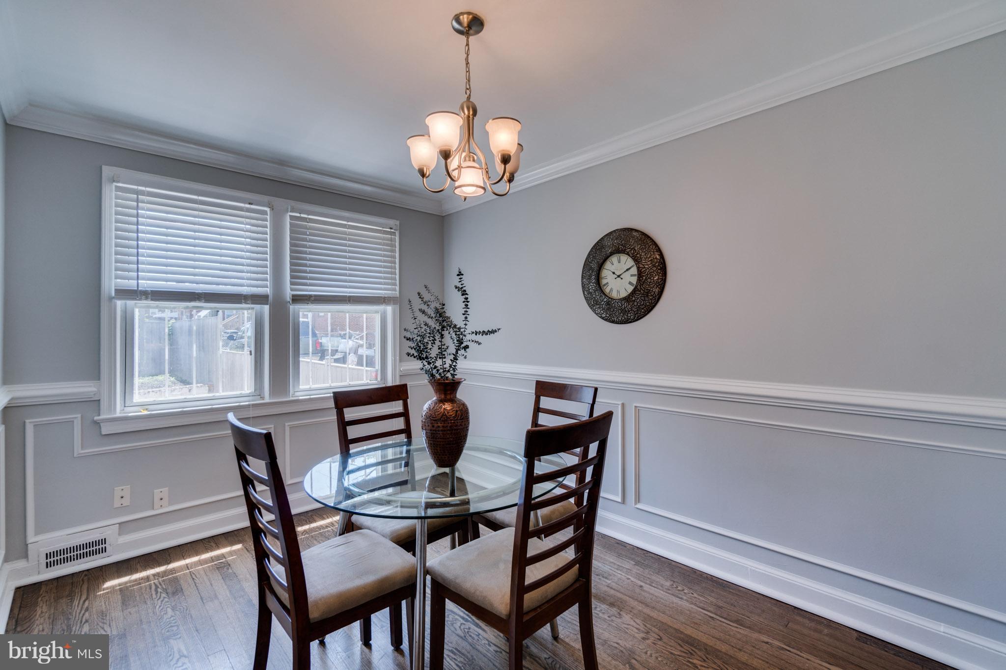 1911 D Street Northeast Washington, DC 20002 - Photo 11 of 25 a view of a dining room with furniture window and wooden floor