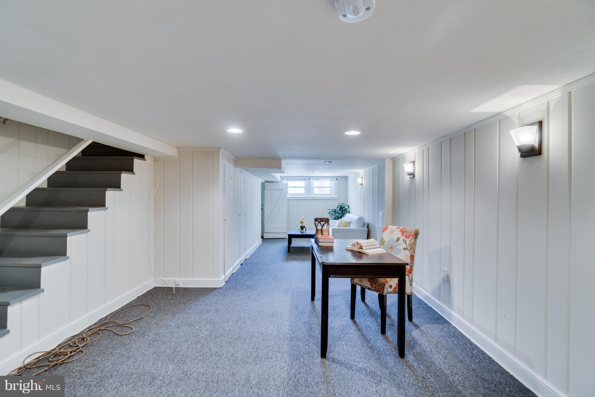 1911 D Street Northeast Washington, DC 20002 - Photo 21 of 25 a room with furniture and a table