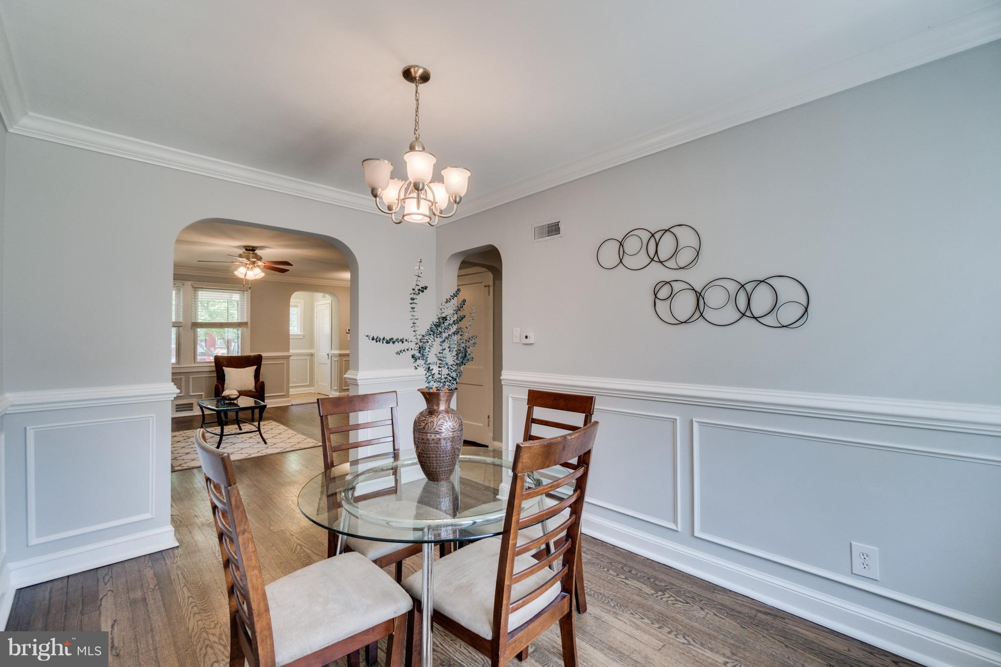 1911 D Street Northeast Washington, DC 20002 - Photo 10 of 25 a view of a dining room with furniture wooden floor and chandelier