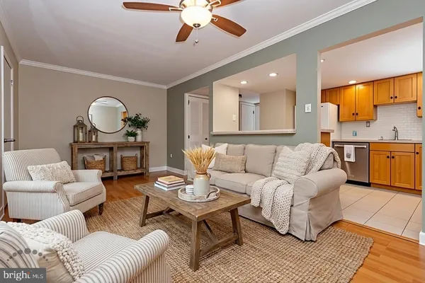 a view of an empty room with a window and a ceiling fan