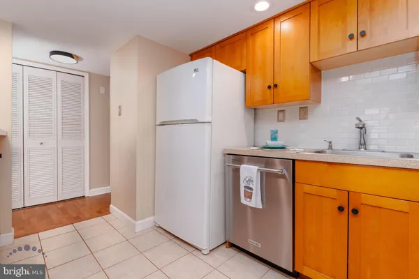a view of kitchen with furniture and wooden floor