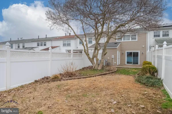 a view of a house with a snow in the yard