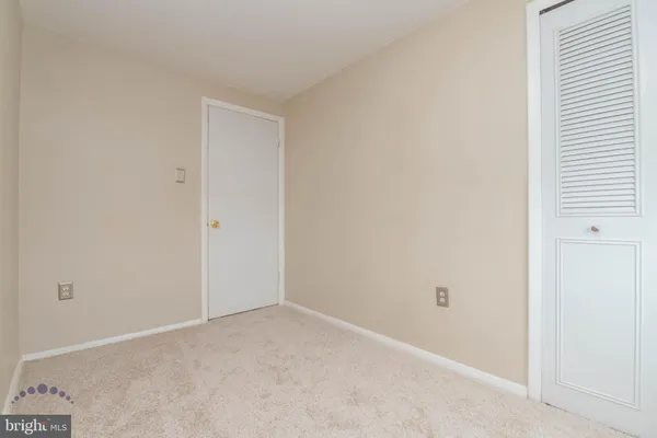 a view of a lake with houses in the back