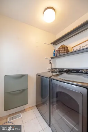 a view of a lake with boats and trees in the background