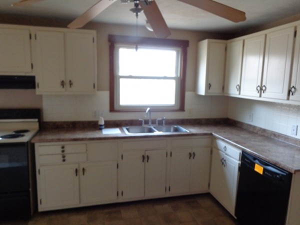 34 Mark Street Springfield, MA 01129 - Photo 5 of 15 a kitchen with cabinets appliances and a sink